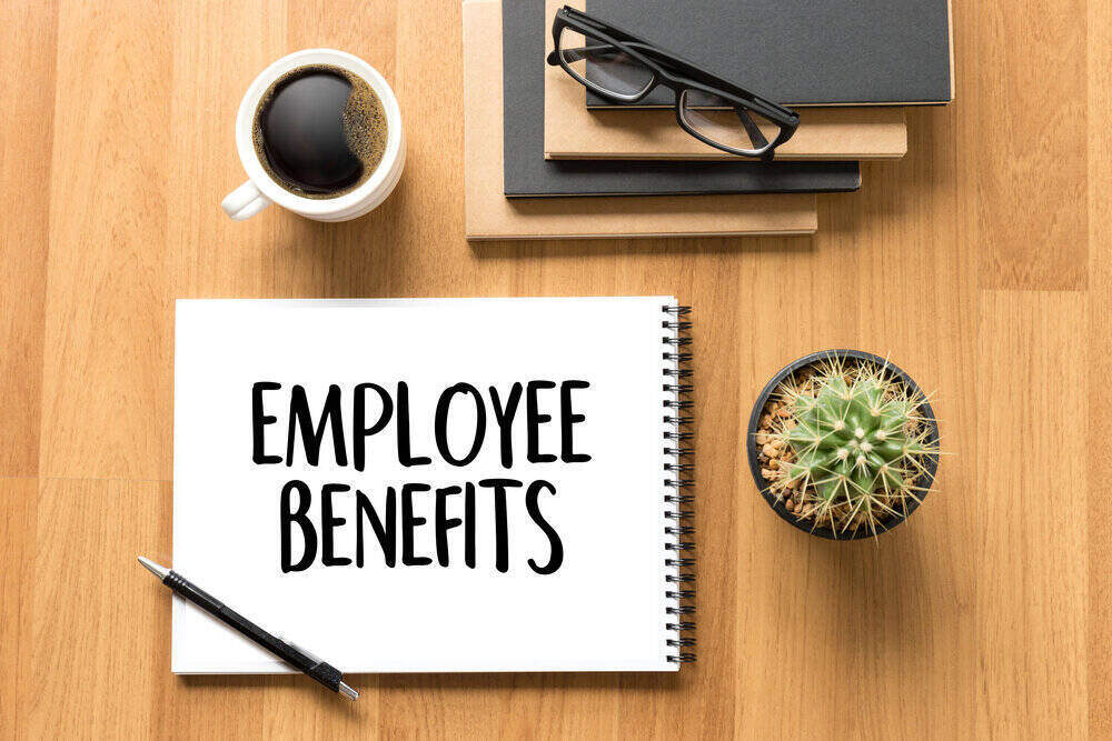 Employee Checking Health Insurance And Retirement Options